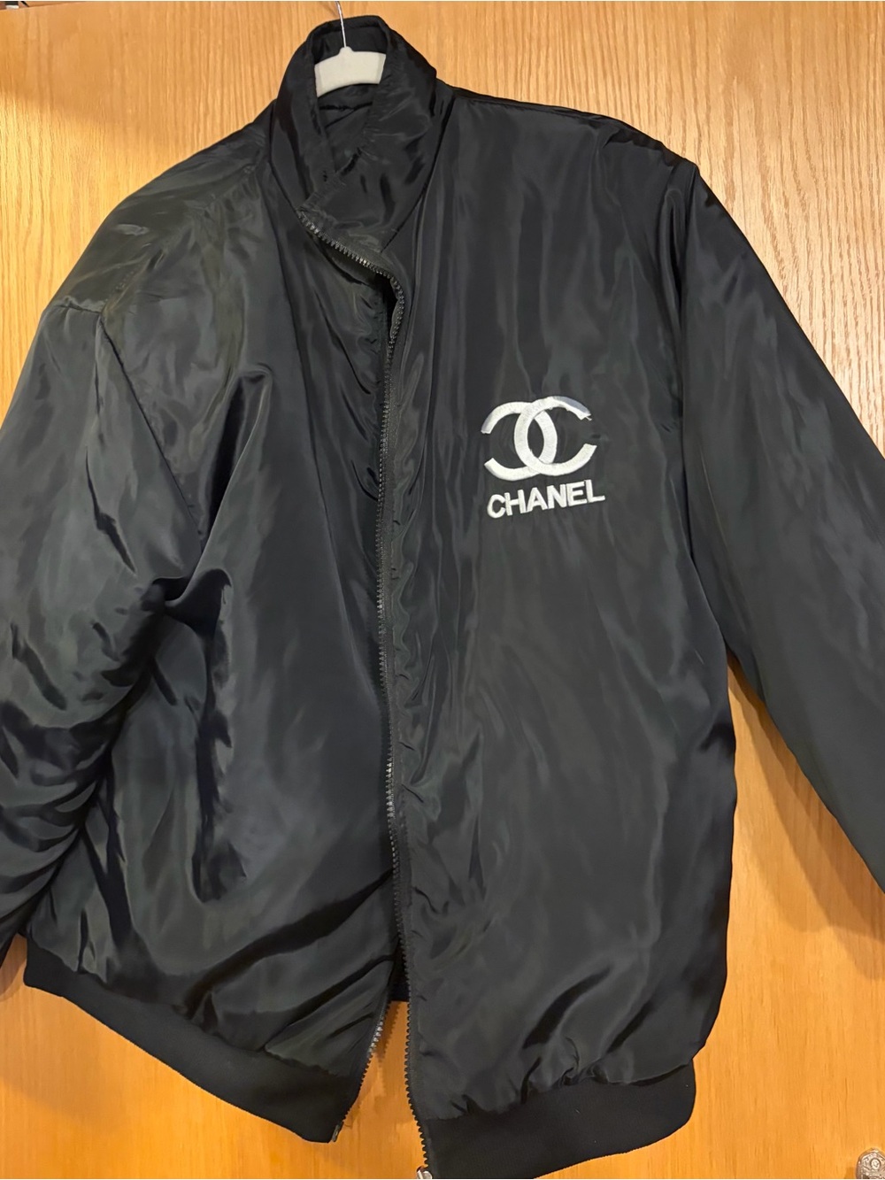 CHANEL Black Bomber Jacket with White Embroidered Logo
